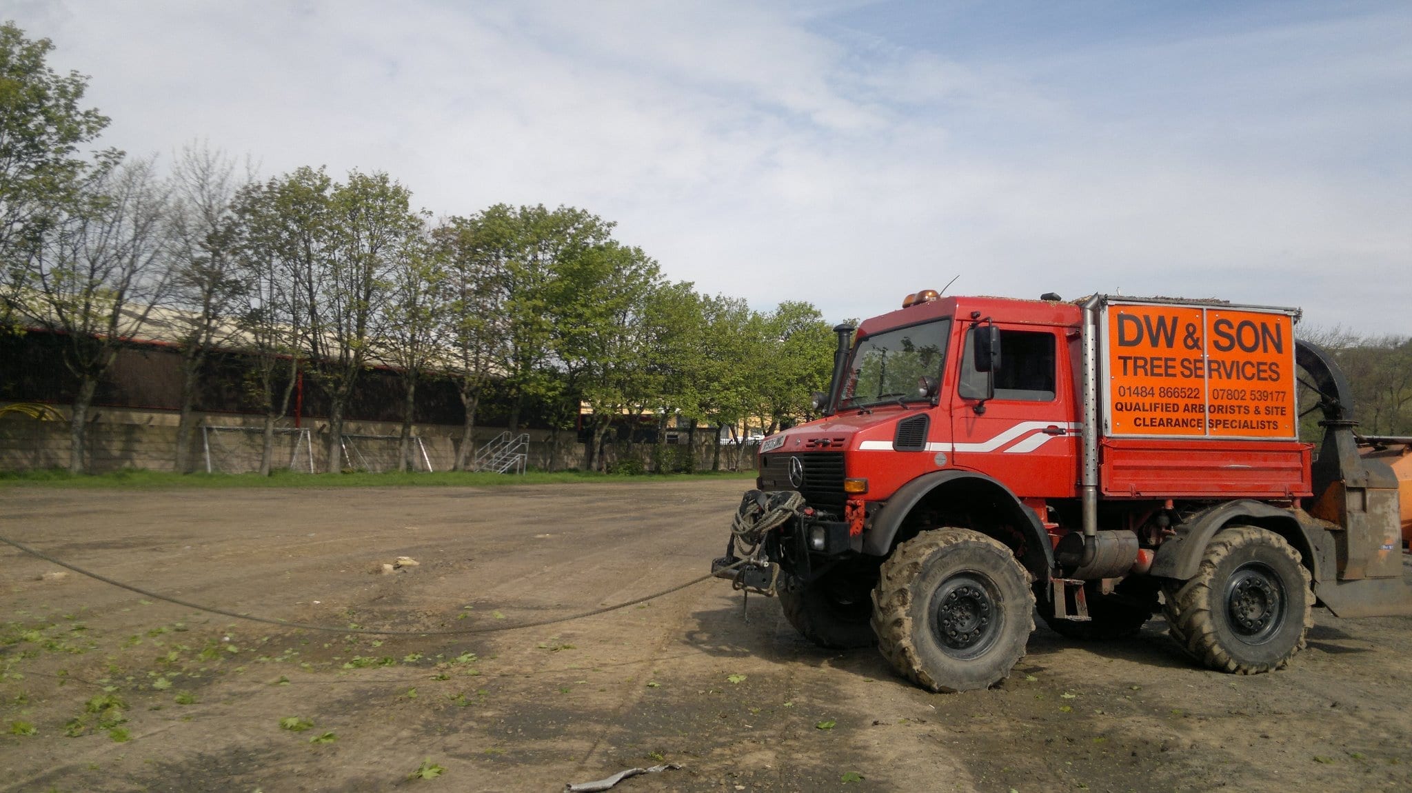 Tree surgeons Unimog with TPO powered wood chipper for chipping trees
